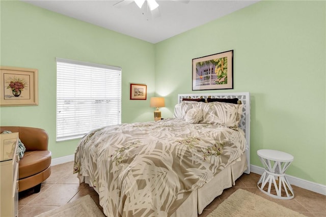 bedroom featuring light tile patterned flooring and ceiling fan