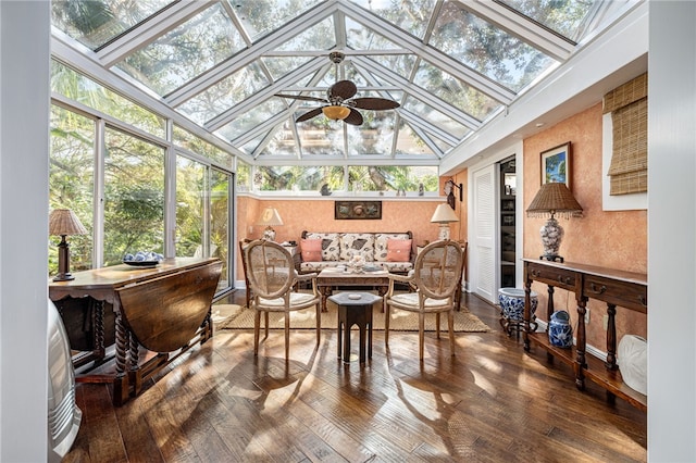 sunroom / solarium featuring ceiling fan, lofted ceiling with skylight, and a healthy amount of sunlight