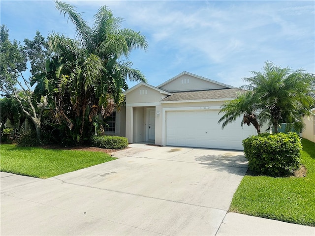 view of front of house with a garage and a front yard