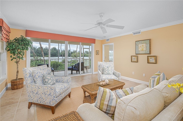 living room with ornamental molding, light tile patterned flooring, visible vents, and baseboards