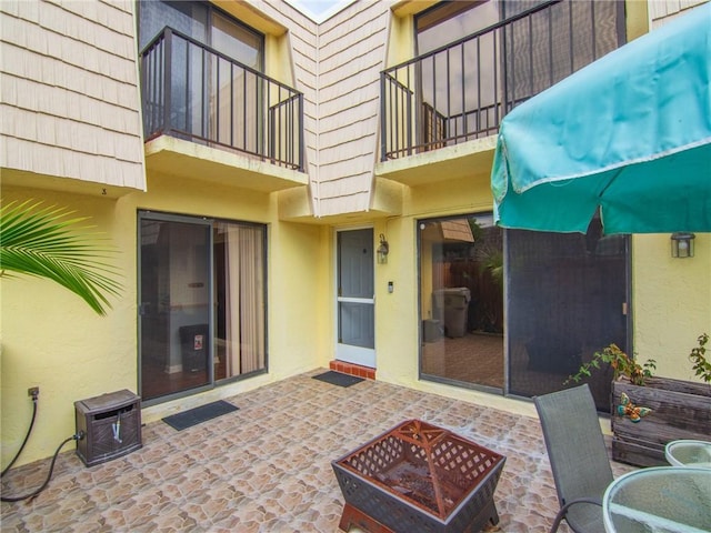 view of patio / terrace featuring a fire pit