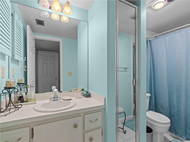 bathroom with toilet, a chandelier, vanity, curtained shower, and tile patterned flooring