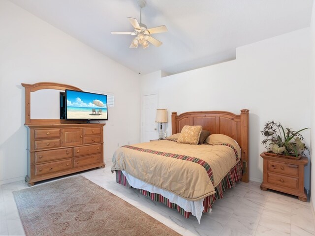 bedroom featuring ceiling fan and lofted ceiling