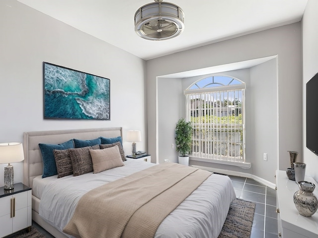 bedroom featuring dark tile patterned flooring