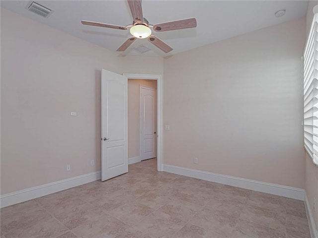 4440 Jacqueline Mnr SW, Vero Beach, FL 32968 - spare room featuring a ceiling fan, baseboards, and a smoke detector