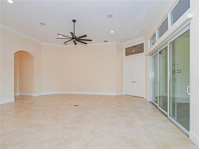 4440 Jacqueline Mnr SW, Vero Beach, FL 32968 - spare room featuring arched walkways, ornamental molding, a ceiling fan, recessed lighting, and baseboards