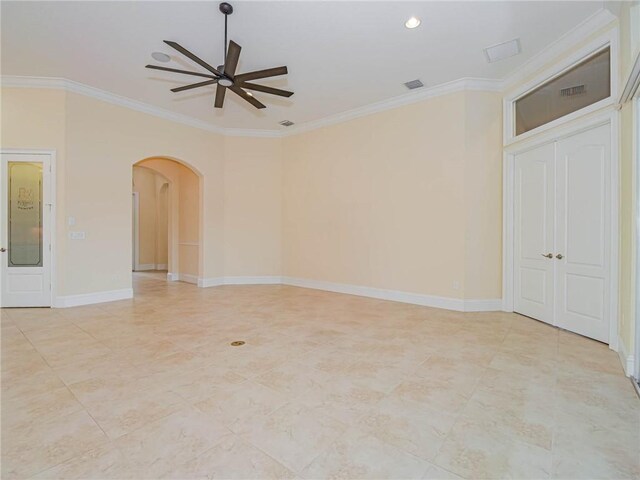 4440 Jacqueline Mnr SW, Vero Beach, FL 32968 - spare room featuring a ceiling fan, arched walkways, ornamental molding, baseboards, and recessed lighting