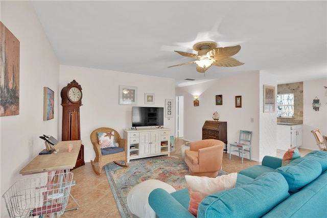 tiled living room featuring ceiling fan