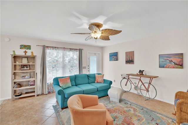 living room with ceiling fan and light tile patterned floors