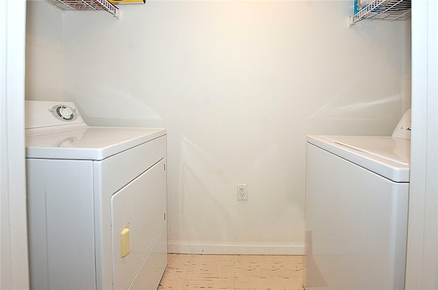 laundry room featuring washing machine and clothes dryer