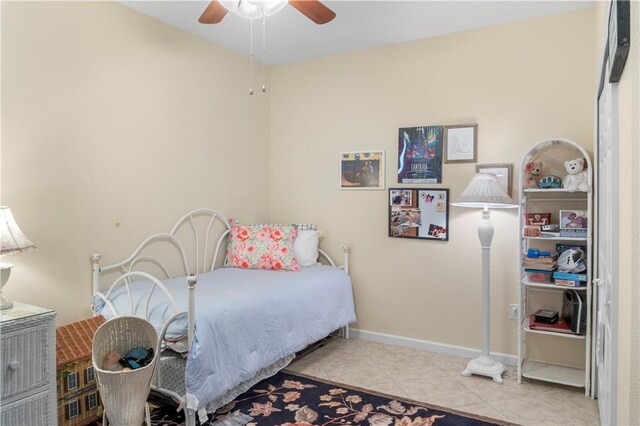 tiled bedroom with ceiling fan