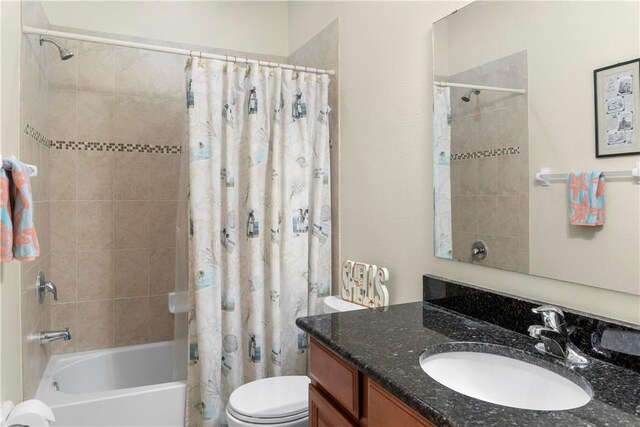 full bathroom featuring vanity, toilet, and shower / bath combo with shower curtain