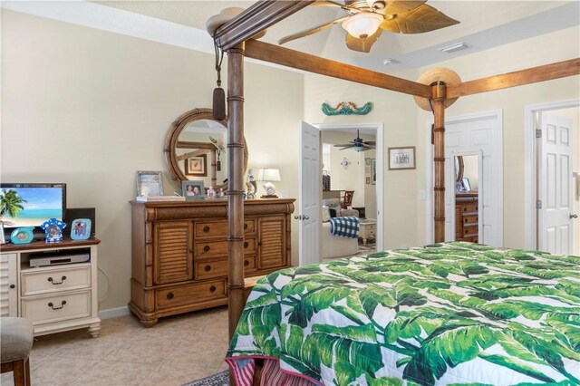 tiled bedroom with ceiling fan