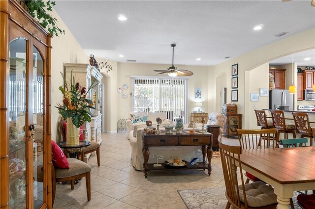 dining area featuring light tile patterned floors and ceiling fan