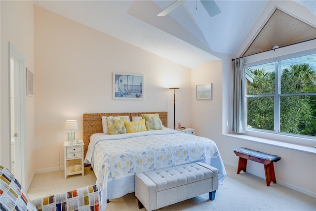 bedroom featuring lofted ceiling, light carpet, and ceiling fan