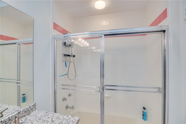 bathroom featuring shower / bath combination with glass door