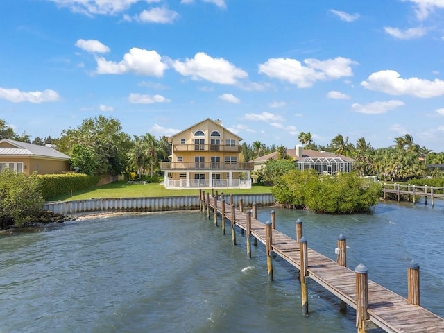 view of dock featuring a water view and a balcony