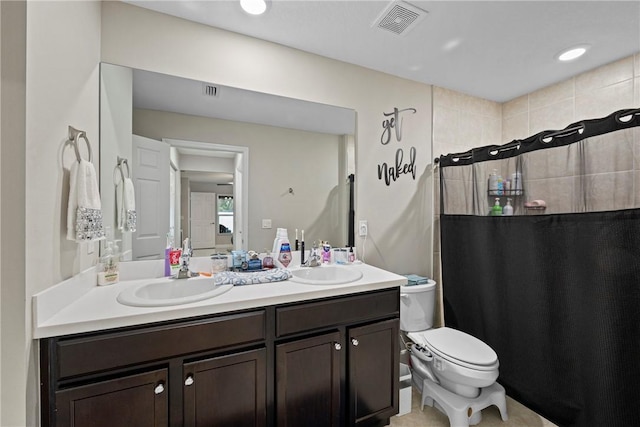 bathroom with a shower with curtain, vanity, and toilet