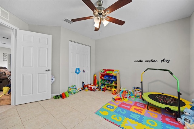 recreation room featuring ceiling fan and light tile patterned flooring