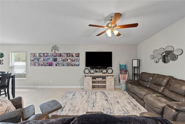 living room featuring ceiling fan and light tile patterned floors