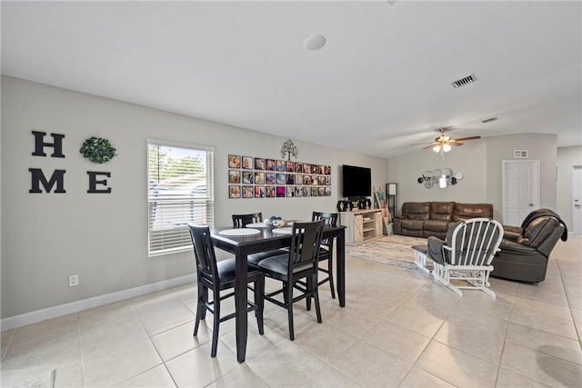 dining area with ceiling fan and light tile patterned floors