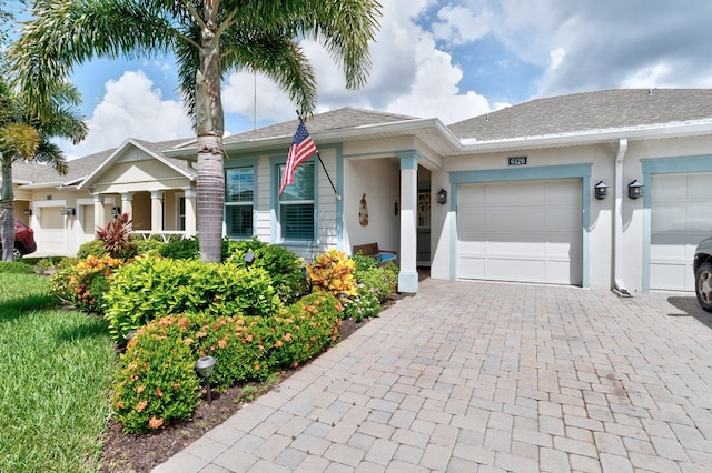 single story home with a garage