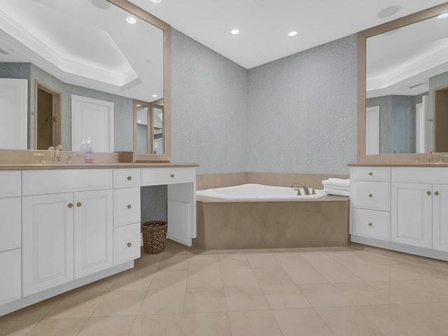 bathroom with vanity, crown molding, and a washtub