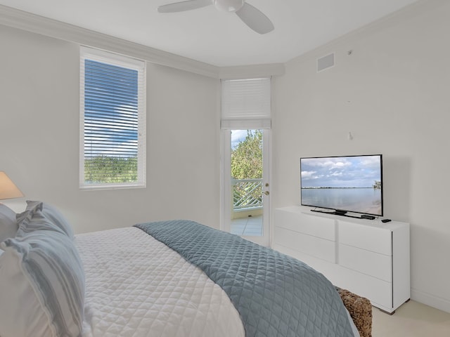 carpeted bedroom featuring multiple windows, ceiling fan, and crown molding