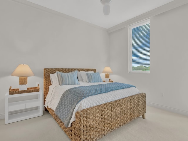 bedroom featuring carpet flooring, ceiling fan, and crown molding