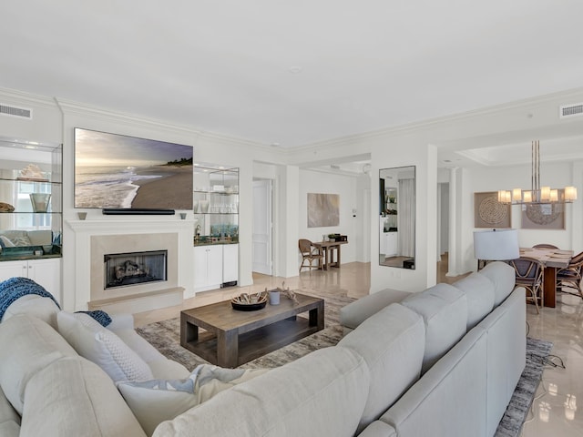 600 Beachview Dr Unit 3N, Vero Beach, FL 32963 - living area with a chandelier, ornamental molding, and a fireplace