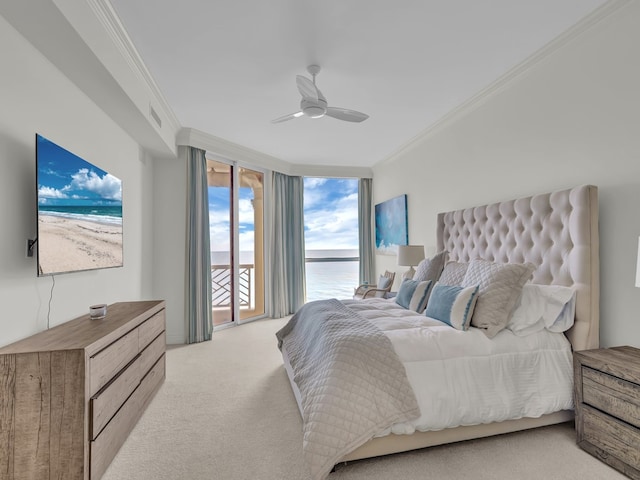 carpeted bedroom featuring ornamental molding, a water view, ceiling fan, and access to exterior