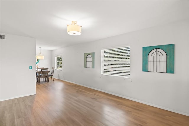 51 Woodland Dr Unit 207, Vero Beach, FL 32962 - unfurnished room with wood finished floors and baseboards