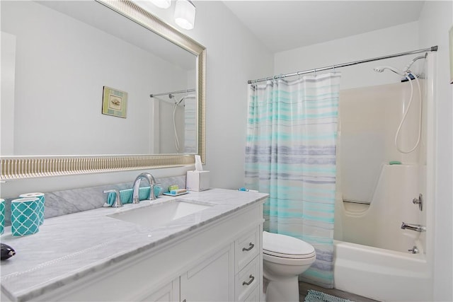 full bathroom featuring vanity, shower / tub combo, and toilet