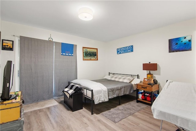 bedroom with light wood-type flooring