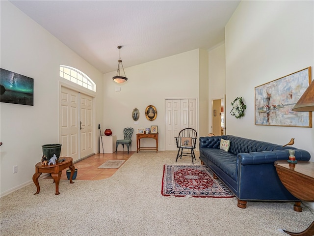 living room featuring high vaulted ceiling and carpet floors