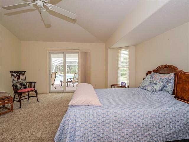 carpeted bedroom featuring multiple windows, lofted ceiling, ceiling fan, and access to exterior