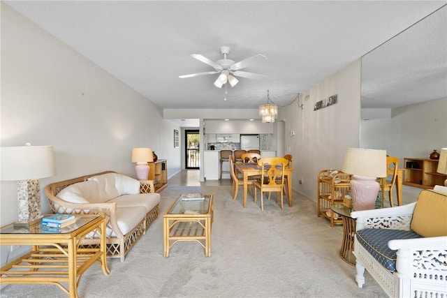 living room with carpet floors and a ceiling fan