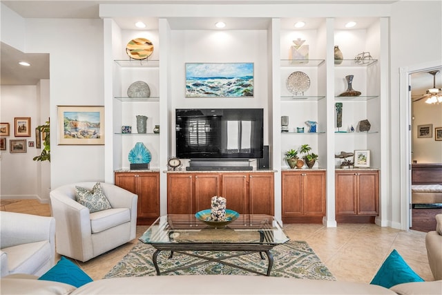 tiled living room featuring built in features and ceiling fan