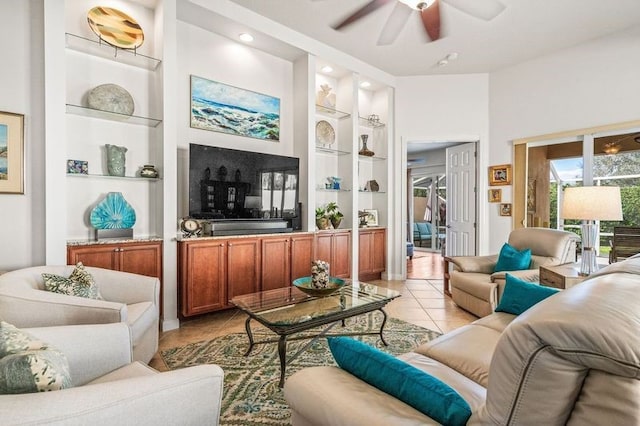 living room featuring built in shelves, light tile patterned flooring, and ceiling fan