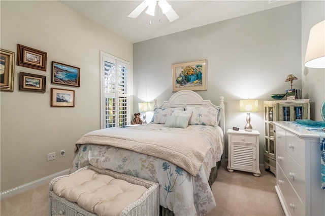 bedroom with ceiling fan and light carpet