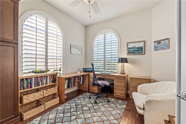 office area featuring vaulted ceiling, ceiling fan, dark hardwood / wood-style flooring, and plenty of natural light