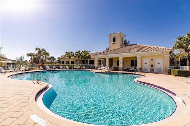 view of swimming pool with a patio