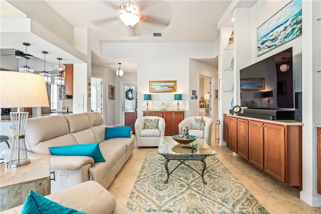 tiled living room featuring ceiling fan