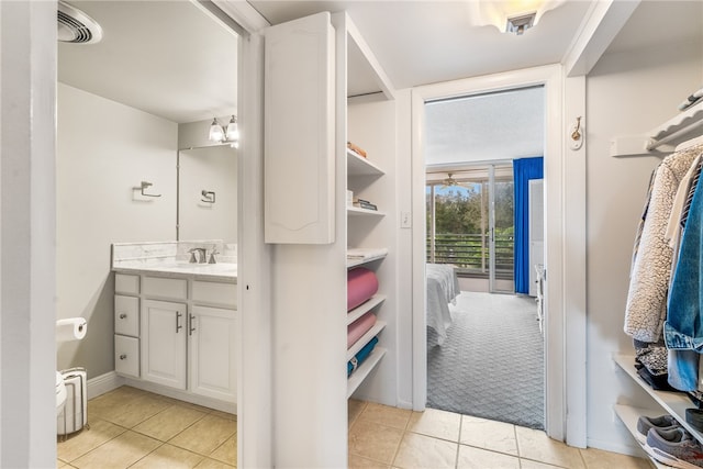 bathroom with vanity and tile patterned floors