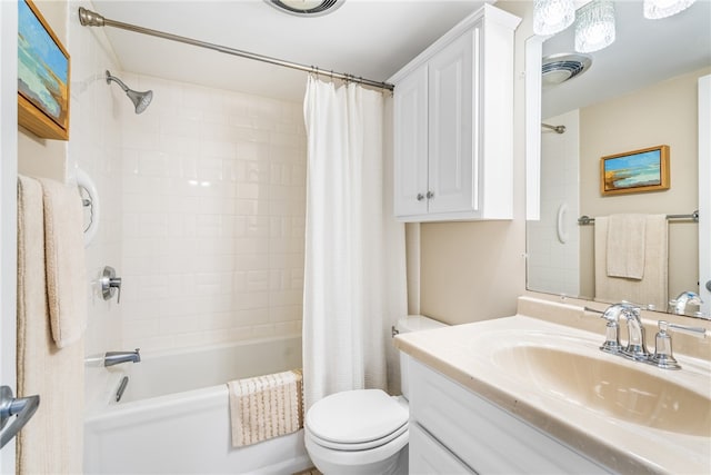 full bathroom featuring shower / tub combo with curtain, vanity, and toilet