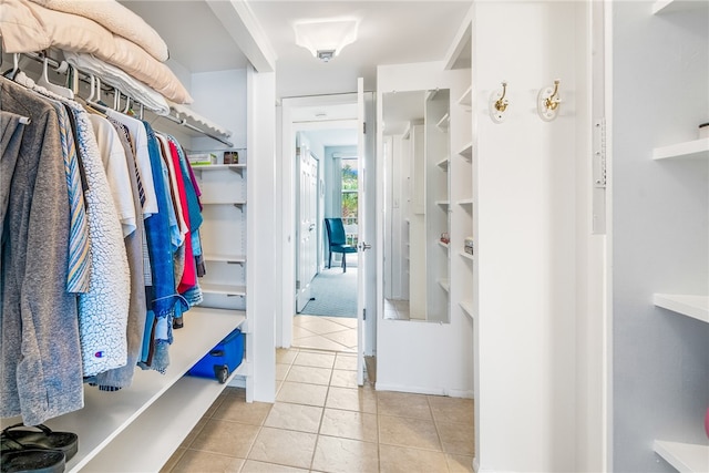 walk in closet featuring light tile patterned floors