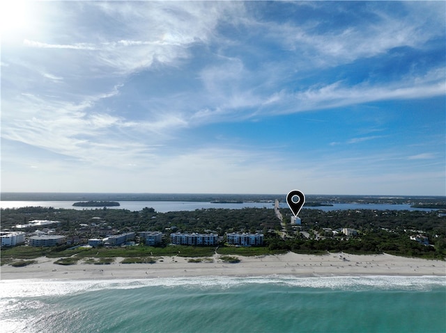 aerial view with a beach view and a water view