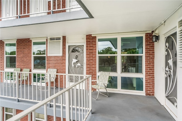 entrance to property with a balcony