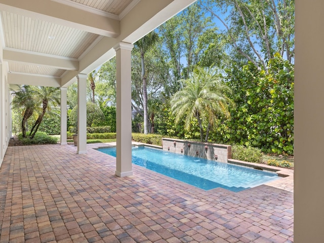 view of pool featuring a patio and pool water feature