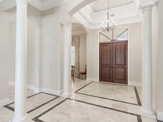 entryway featuring a notable chandelier and ornamental molding